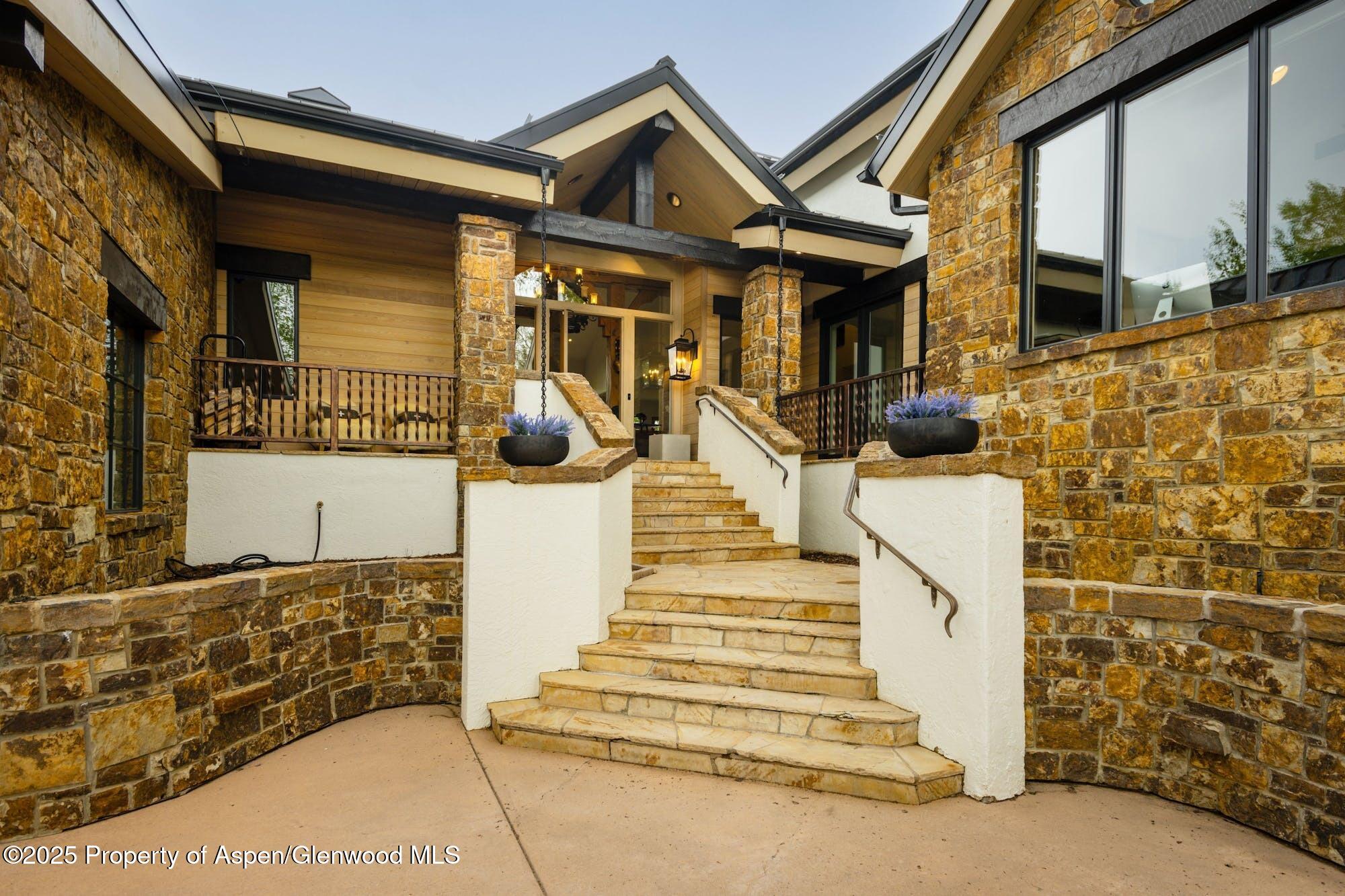 350 Spruce Ridge Lane Snowmass Village, CO 81615 - Photo 4 of 38 a view of a house with wooden fence