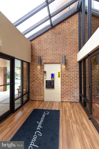a living room filled with furniture and a floor to ceiling window