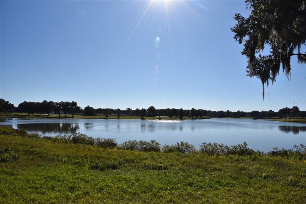 301 Off Highway Summerfield, FL 34491 - Photo 4 of 29 a view of a lake with houses in outdoor space
