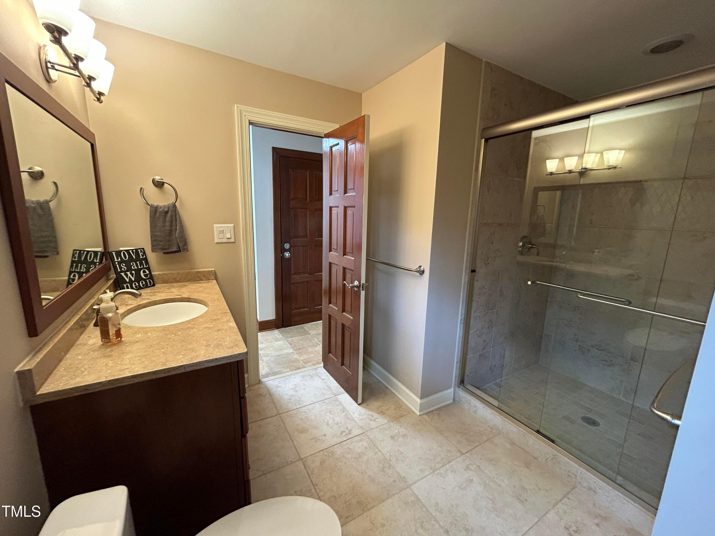 106 Springbrook Place Cary, NC 27518 - Photo 19 of 49 a bathroom with a sink toilet and shower