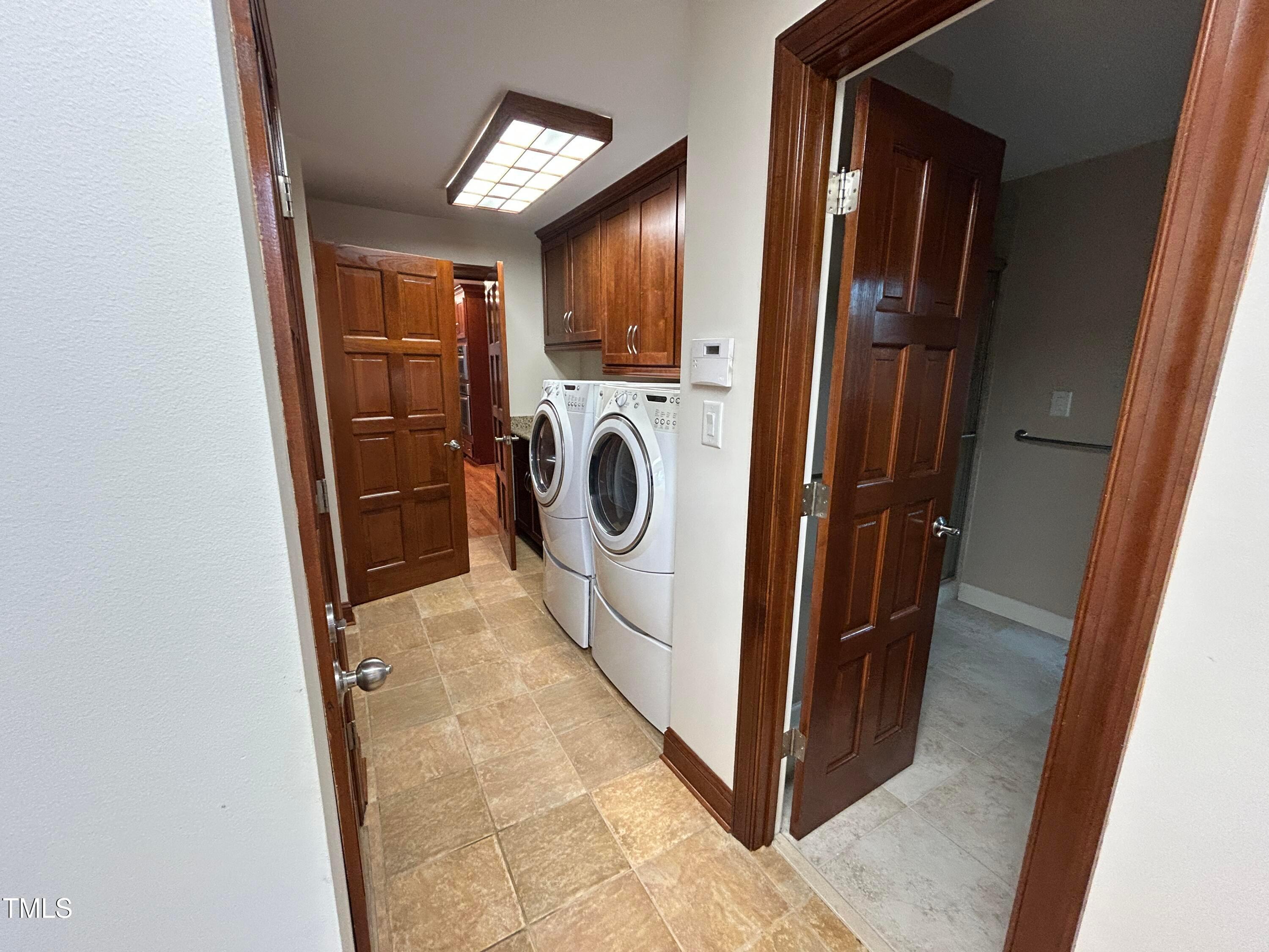 106 Springbrook Place Cary, NC 27518 - Photo 21 of 49 a view of a hallway with washer and dryer