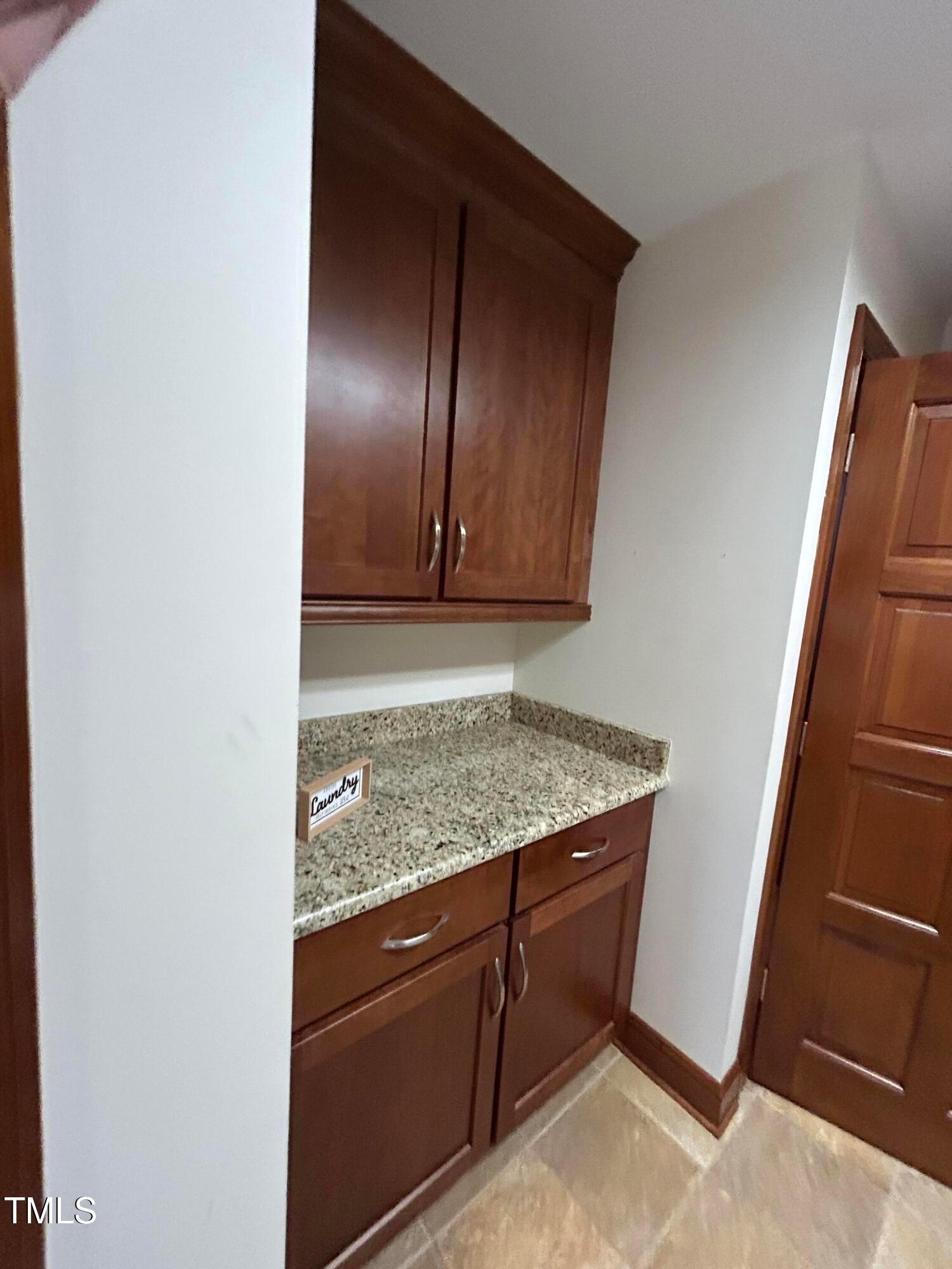 106 Springbrook Place Cary, NC 27518 - Photo 22 of 49 a view of cabinets and wooden floor