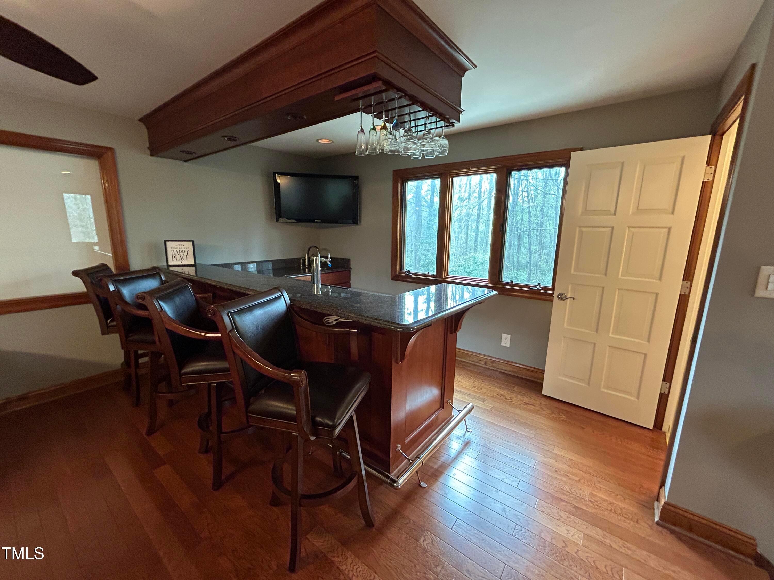 106 Springbrook Place Cary, NC 27518 - Photo 26 of 49 a view of a dining room with furniture window and wooden floor