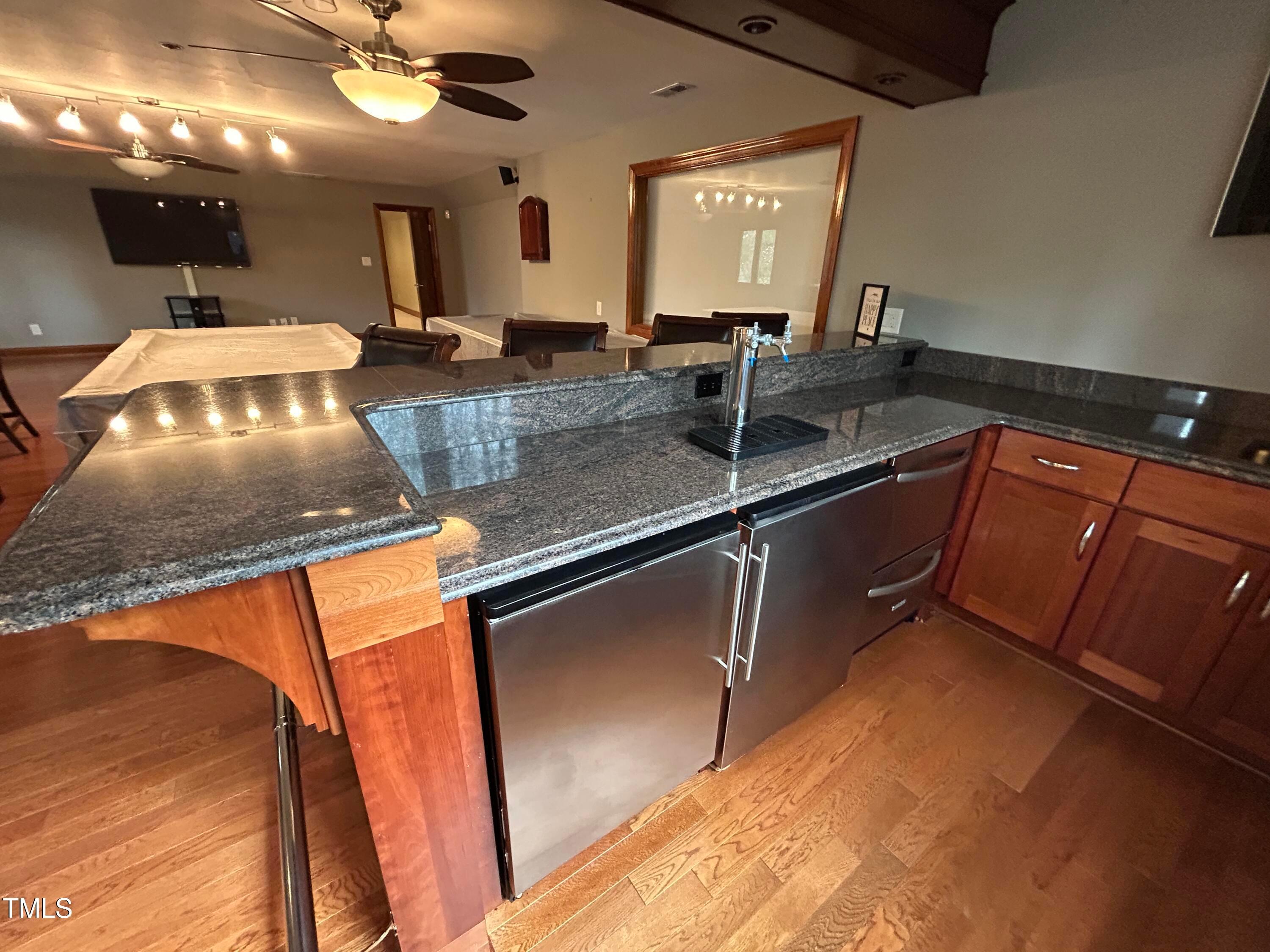 106 Springbrook Place Cary, NC 27518 - Photo 27 of 49 a kitchen with stainless steel appliances granite countertop a sink stove and cabinets