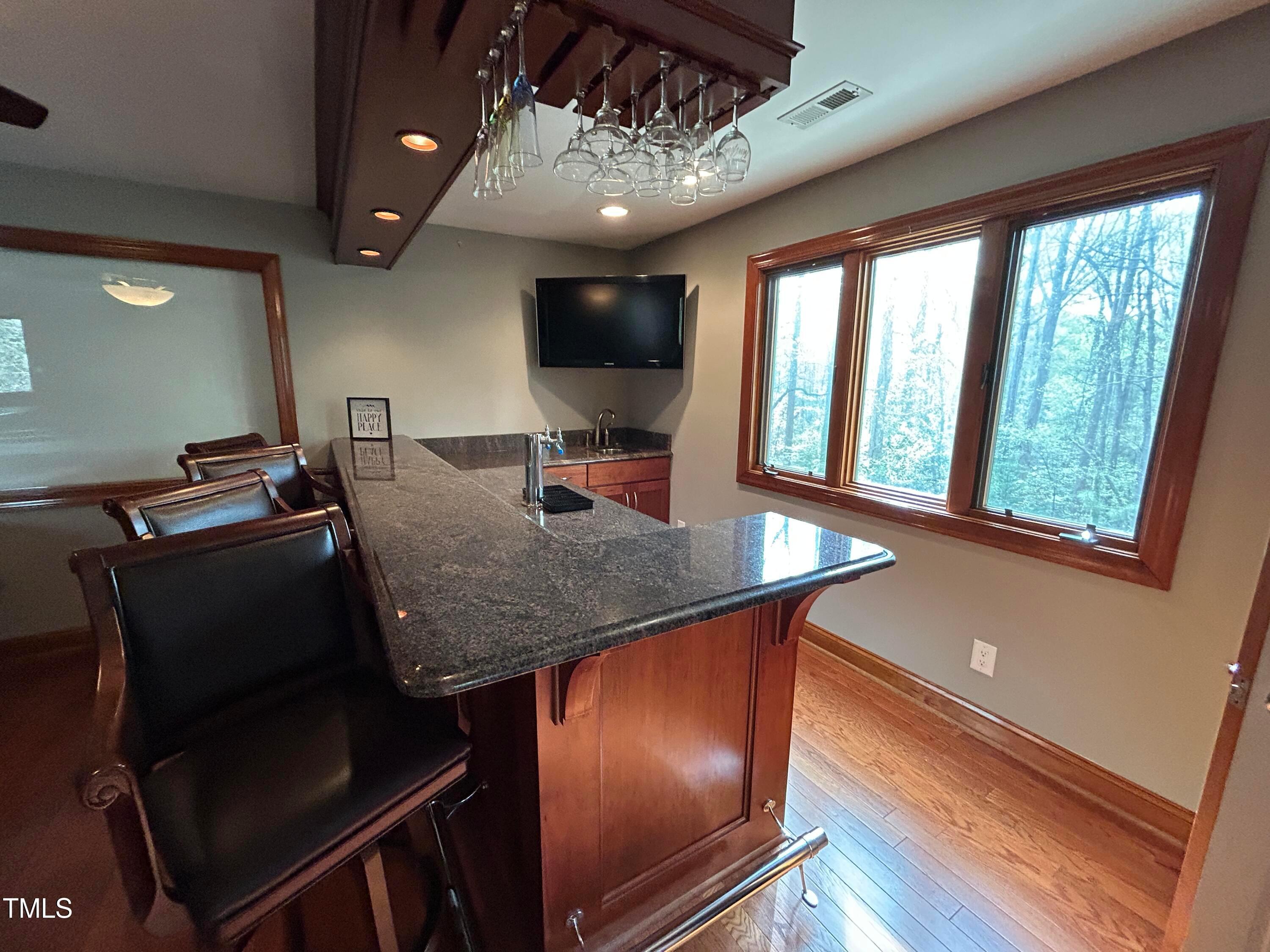 106 Springbrook Place Cary, NC 27518 - Photo 31 of 49 a view of a dining room with furniture window and wooden floor