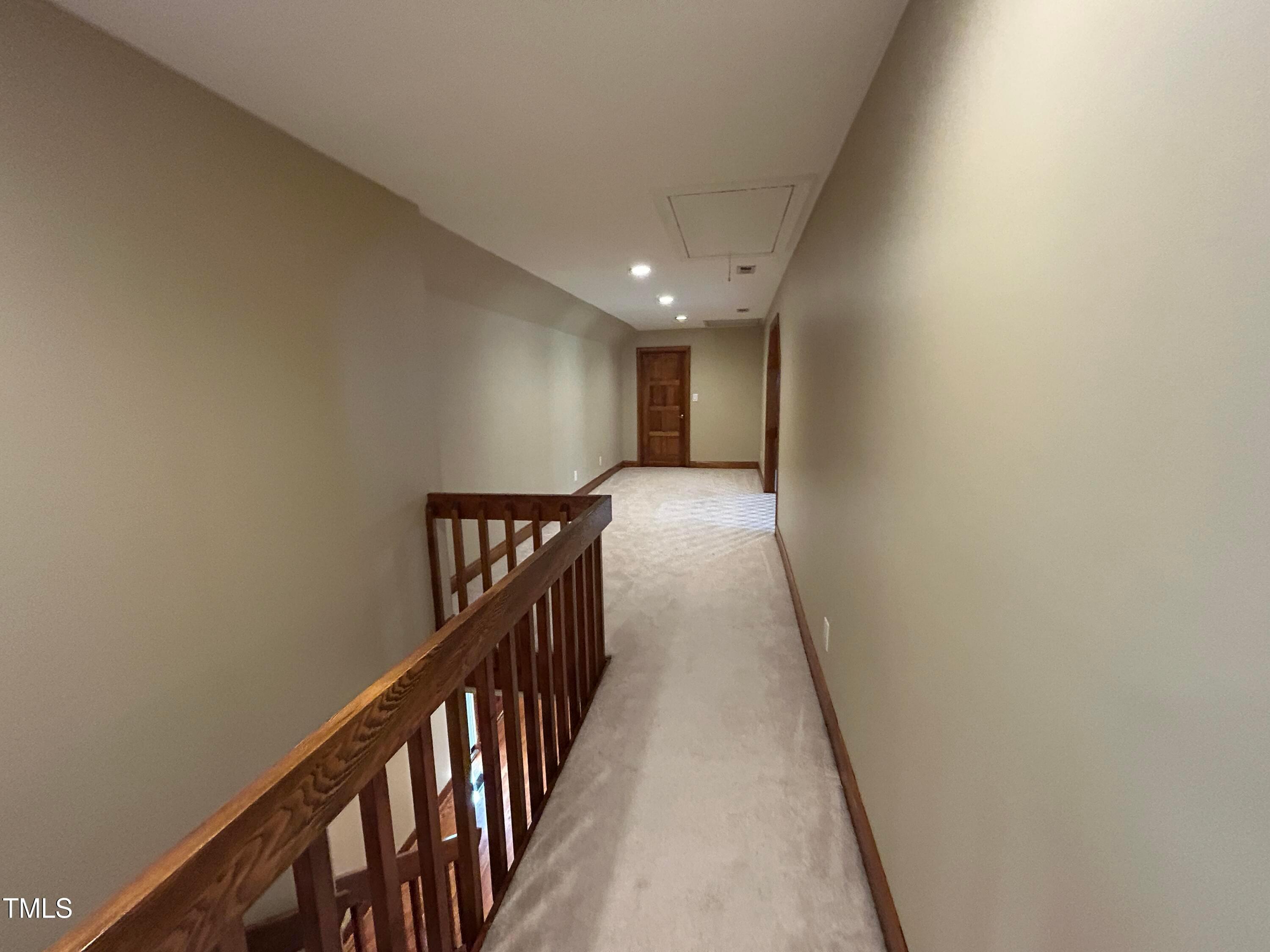 106 Springbrook Place Cary, NC 27518 - Photo 33 of 49 a view of a hallway with wooden floor