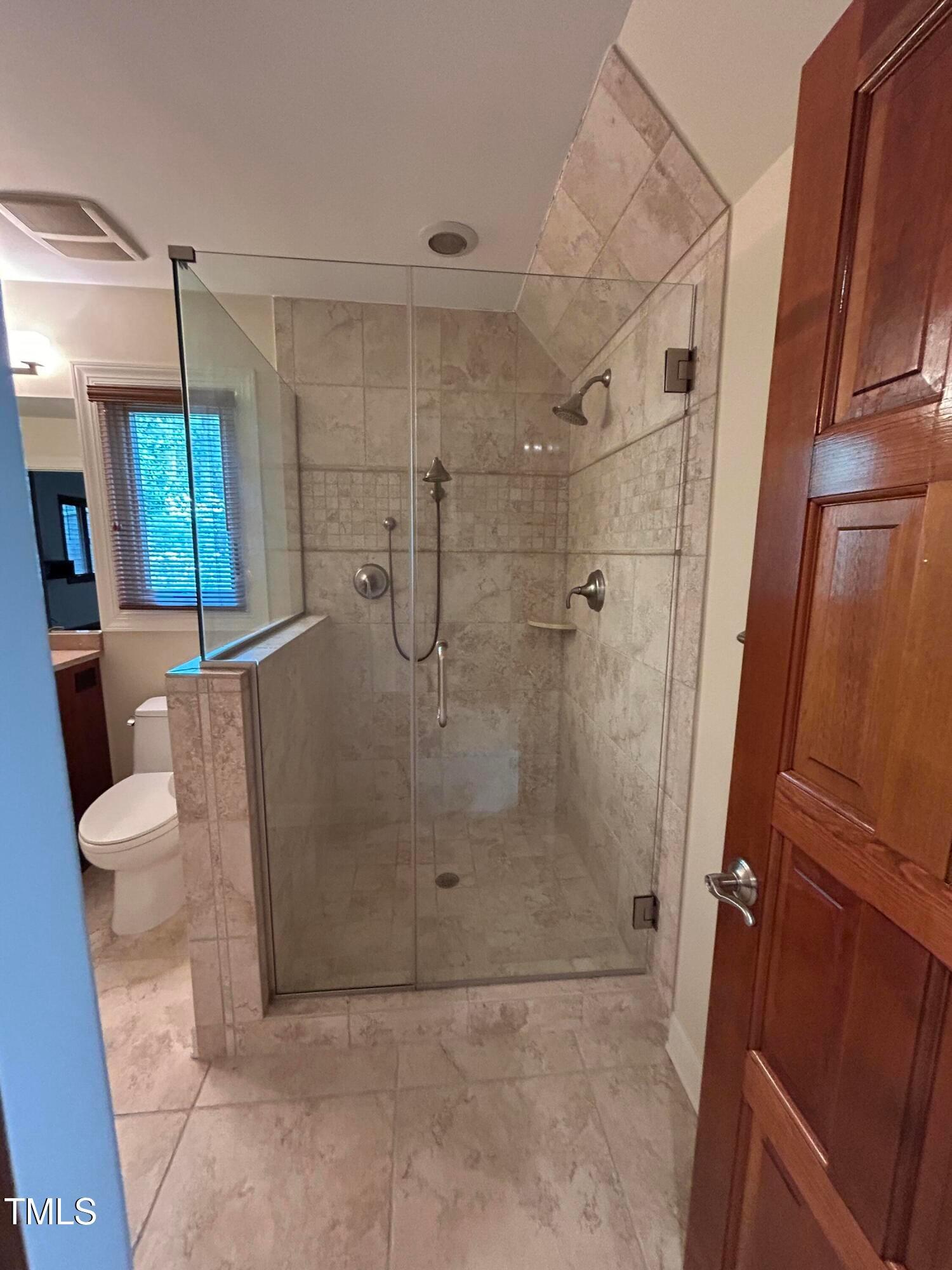 106 Springbrook Place Cary, NC 27518 - Photo 36 of 49 a bathroom with a shower and a toilet