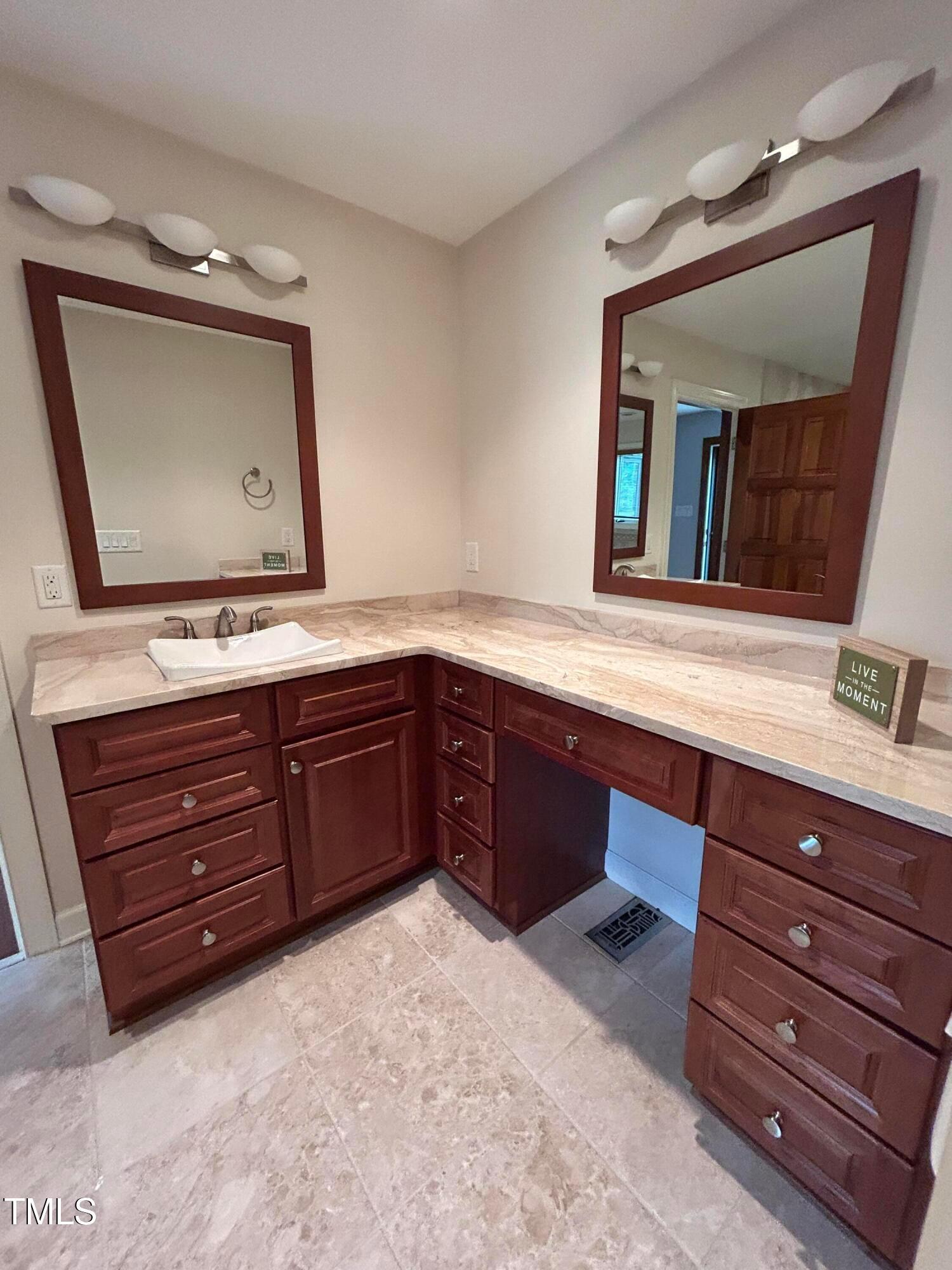 106 Springbrook Place Cary, NC 27518 - Photo 43 of 49 a bathroom with a sink and a mirror