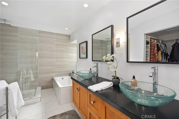 a bathroom with a granite countertop sink a mirror and a