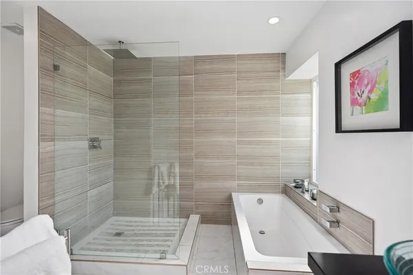 a bathroom with a toilet a sink and bathtub