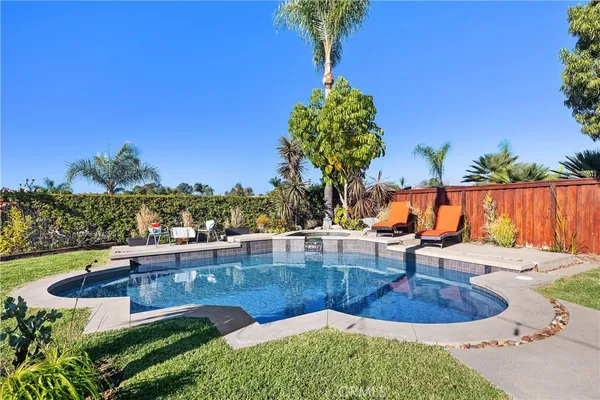 a view of a swimming pool with a patio