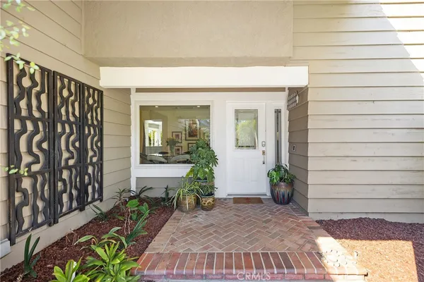 a view of front door and potted plants