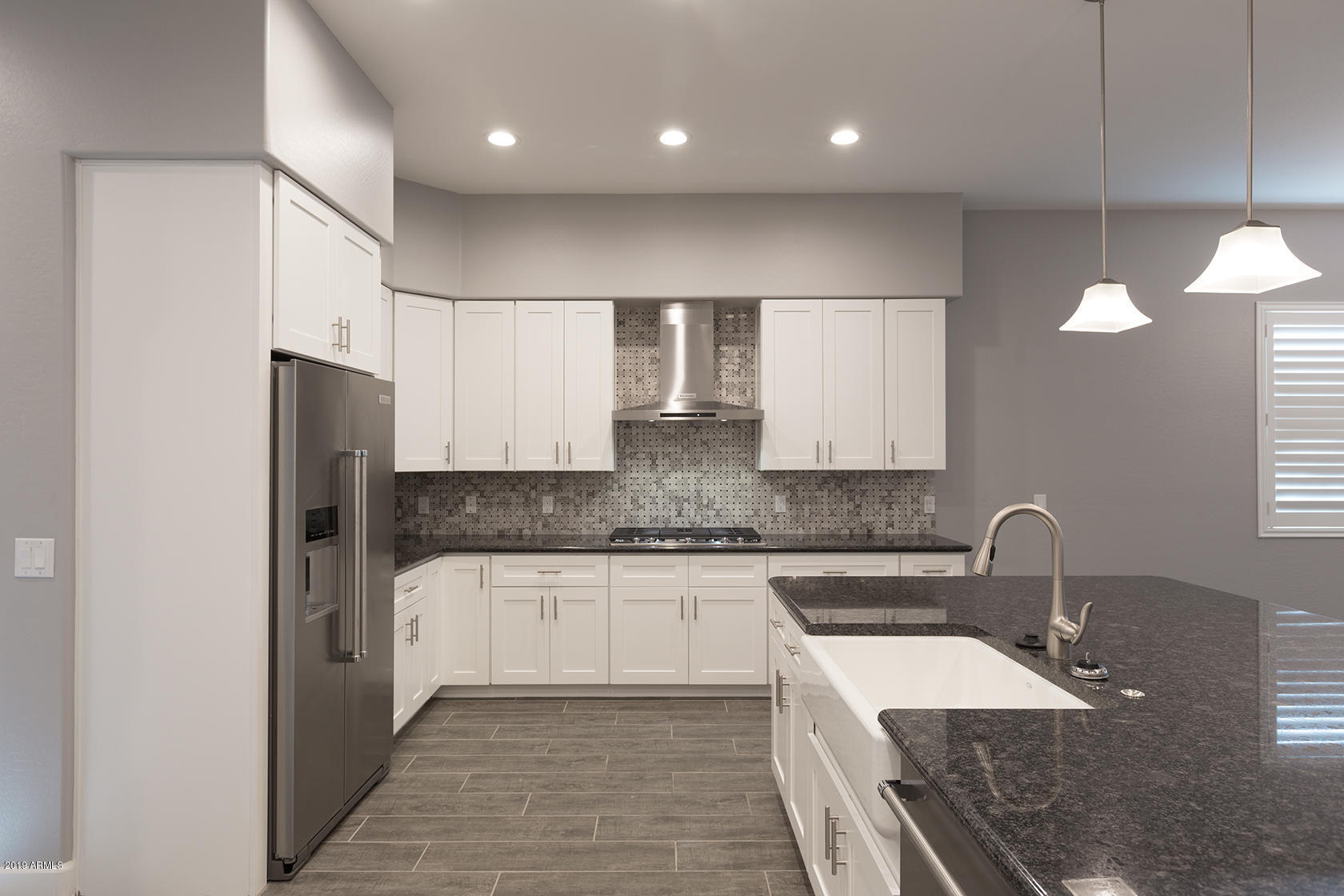 1024 East Curry Road Tempe, AZ 85288 - Photo 6 of 12 a kitchen with stainless steel appliances granite countertop a sink stove and refrigerator