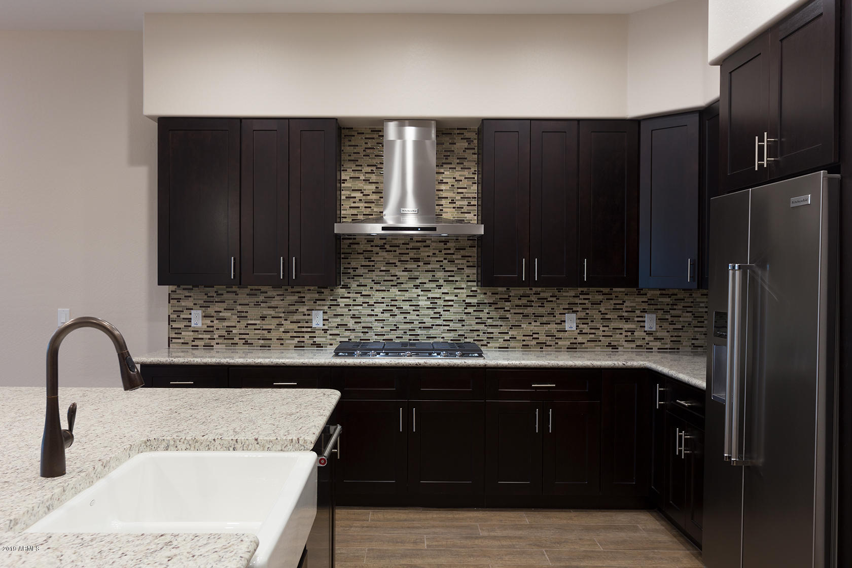 1024 East Curry Road Tempe, AZ 85288 - Photo 10 of 12 a kitchen with a sink and a refrigerator