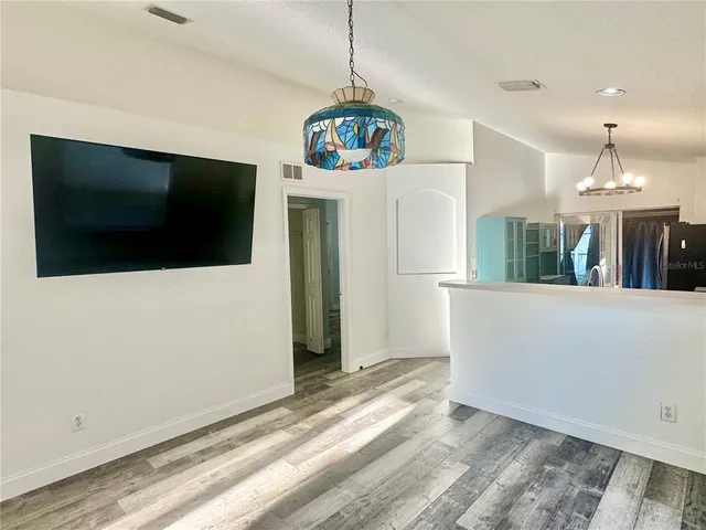 a view of a living room and a flat screen tv