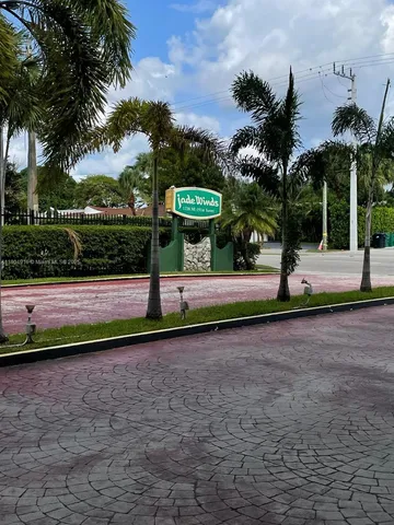 a view of park with large trees