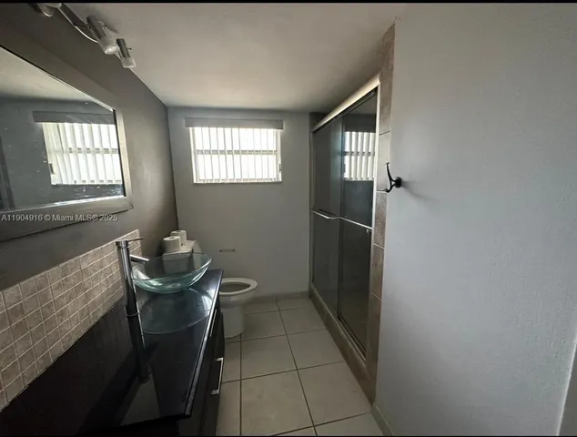 a view of a livingroom with furniture and windows