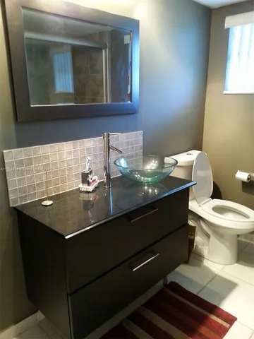 a bathroom with a sink and a toilet