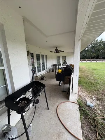a view of a lake with houses in back