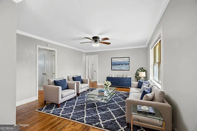 a living room with furniture and a table