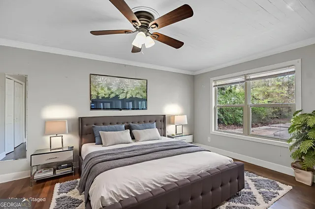 a bedroom with a large bed and a window