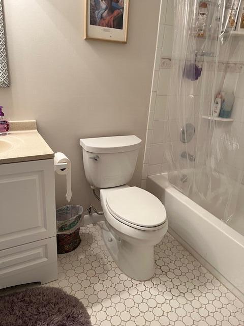 247 Capri F Delray Beach, FL 33484 - Photo 12 of 14 a white toilet sitting next to a bath tub