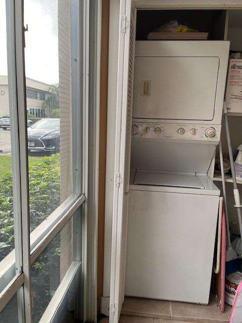 247 Capri F Delray Beach, FL 33484 - Photo 13 of 14 a view of a room with wooden floor washer and dryer