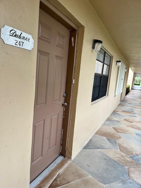 247 Capri F Delray Beach, FL 33484 - Photo 14 of 14 a view of a front door