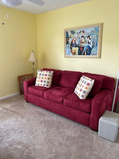 247 Capri F Delray Beach, FL 33484 - Photo 7 of 14 a living room with furniture and a couch