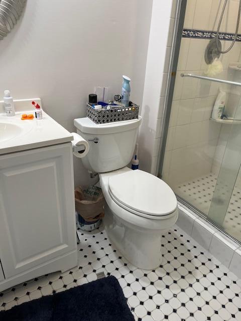 247 Capri F Delray Beach, FL 33484 - Photo 9 of 14 a white toilet sitting next to a bathroom sink