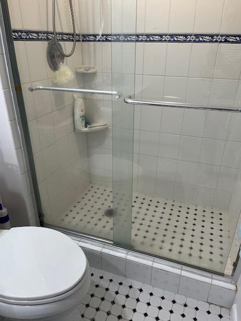 247 Capri F Delray Beach, FL 33484 - Photo 10 of 14 a bathroom with a shower