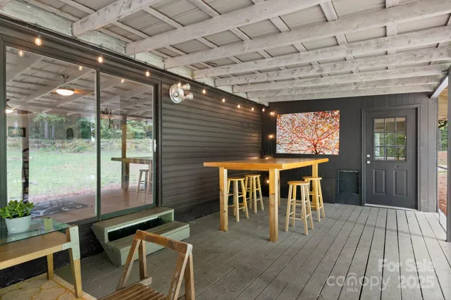a dining room with furniture and wooden floor