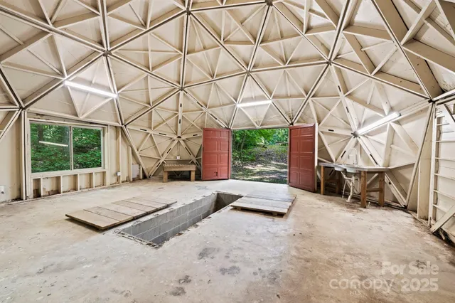 a view of a big yard with lots of green space