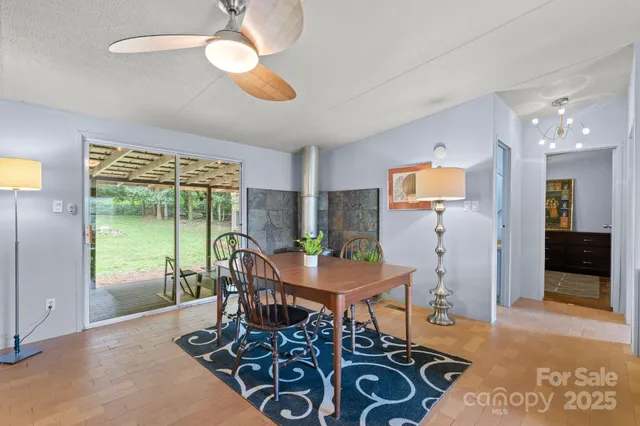 a view of a dining room with furniture window and outside view