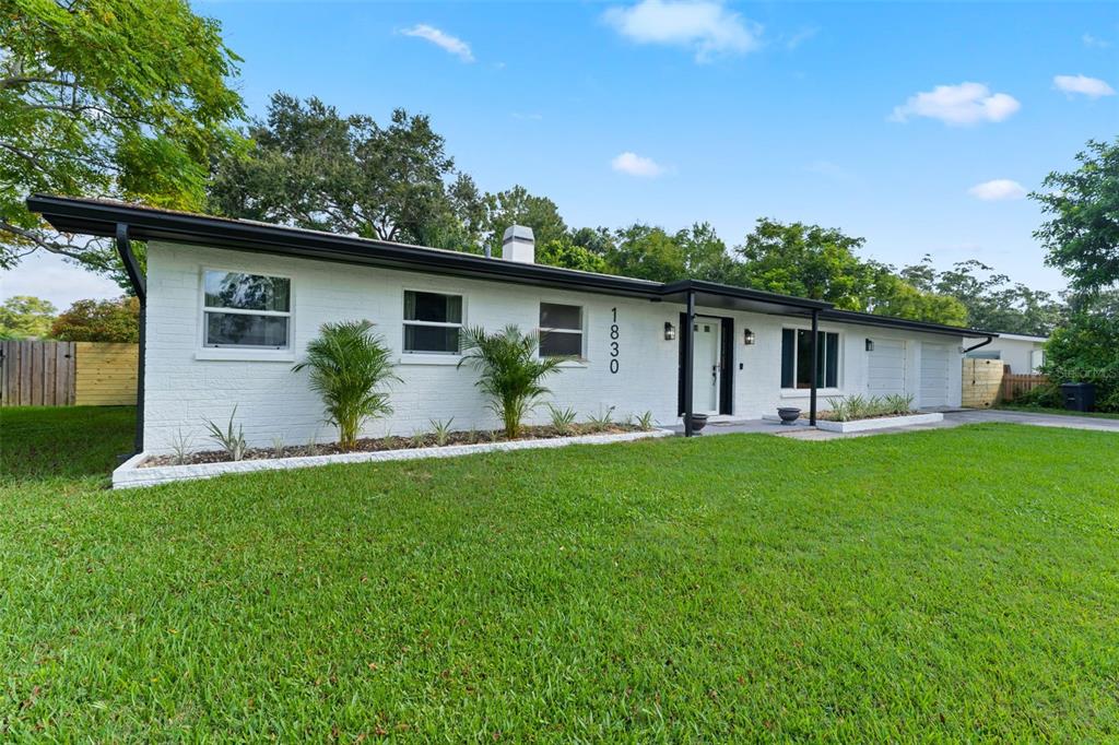 1830 Lakeview Road Clearwater, FL 33764 - Photo 2 of 38 a front view of house with yard and green space
