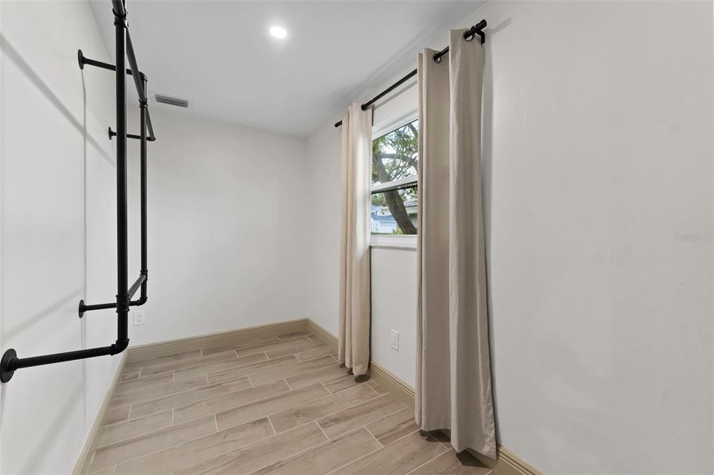 1830 Lakeview Road Clearwater, FL 33764 - Photo 21 of 38 a view of empty room with wooden floor and fan