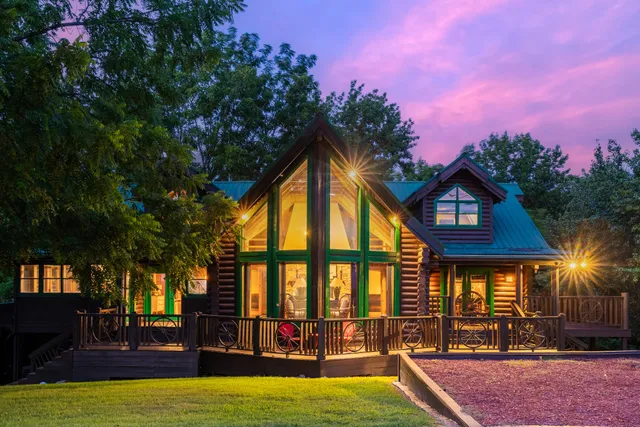 a view of a house with swimming pool and sitting area