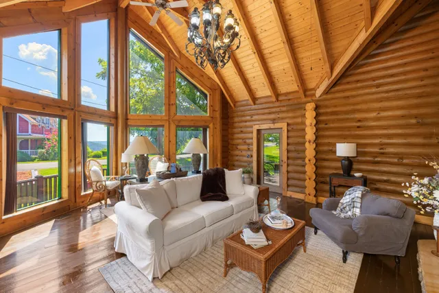 a bathroom with a granite countertop sink a mirror and a shower