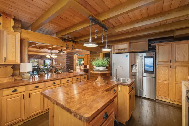 a view of a kitchen counter top a sink and dishwasher
