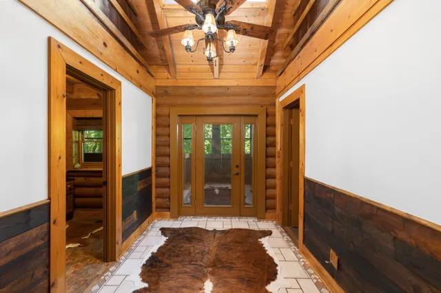 a room with gym equipment and a large window