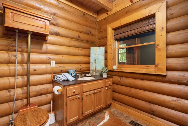 a kitchen that has a sink and a stove in it