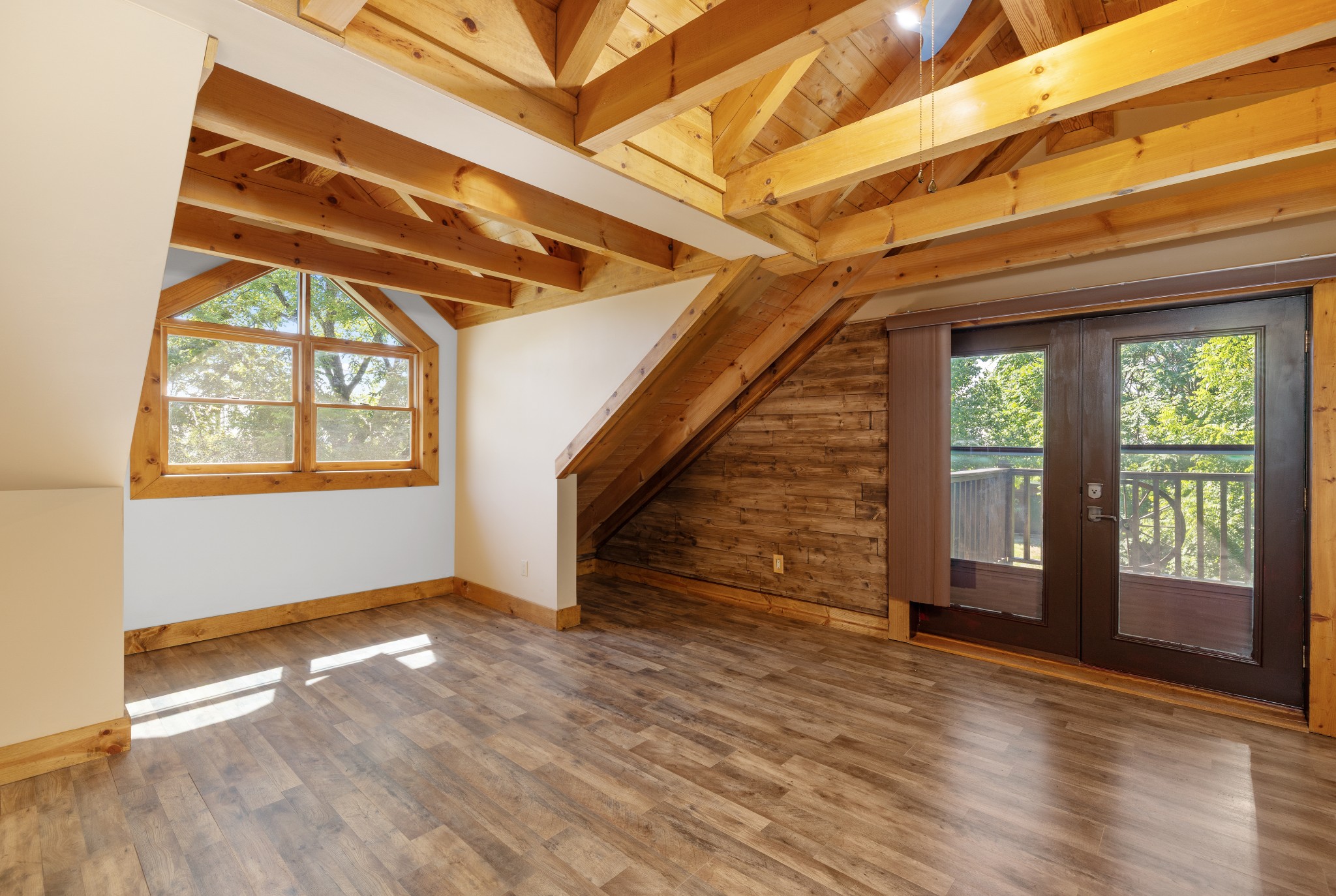 158 Dillon Road Baxter, TN 38544 - Photo 48 of 93 an empty room with wooden floor and windows