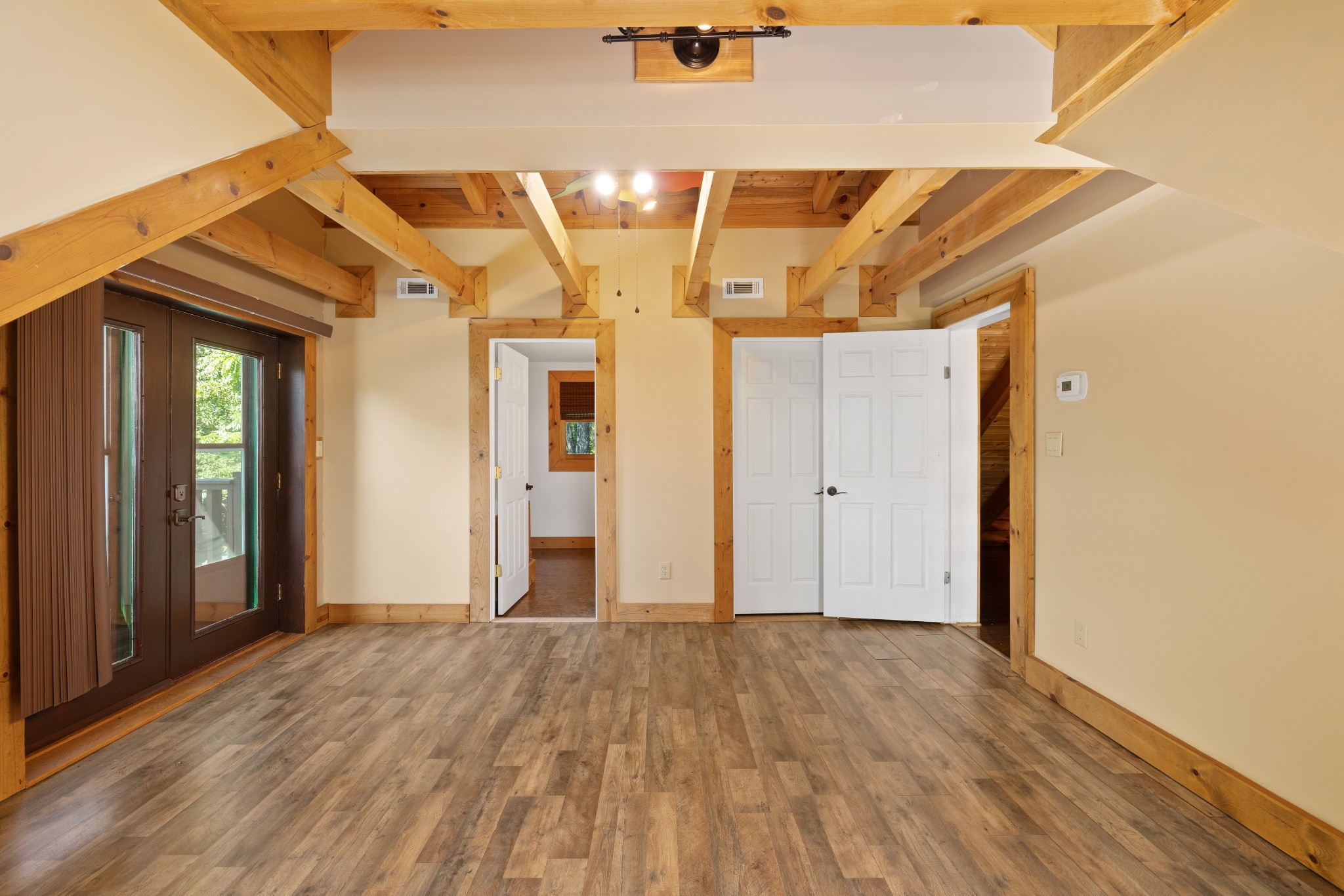 158 Dillon Road Baxter, TN 38544 - Photo 49 of 93 an empty room with wooden floor and windows