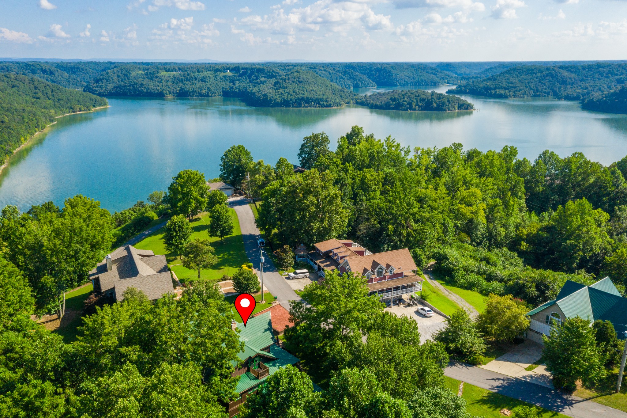 158 Dillon Road Baxter, TN 38544 - Photo 92 of 93 an aerial view of residential houses with outdoor space and lake view