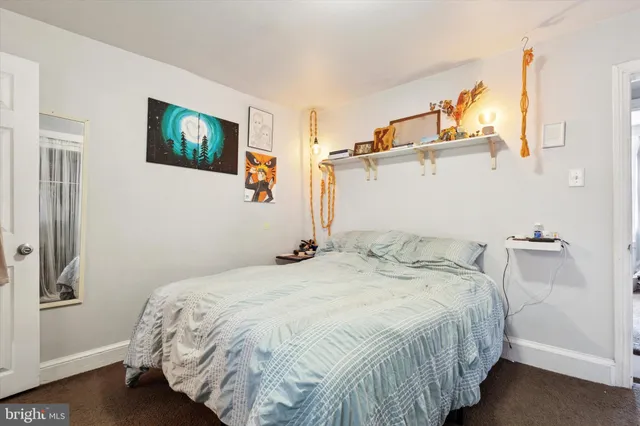 a bathroom with a sink and mirror with toilet