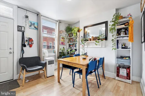 a view of a dining room with furniture and window