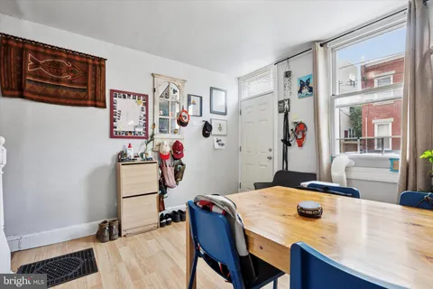 a kitchen with stainless steel appliances granite countertop a stove a sink dishwasher and cabinets with wooden floor