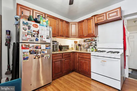 a living room with granite countertop furniture a sink and dishwasher