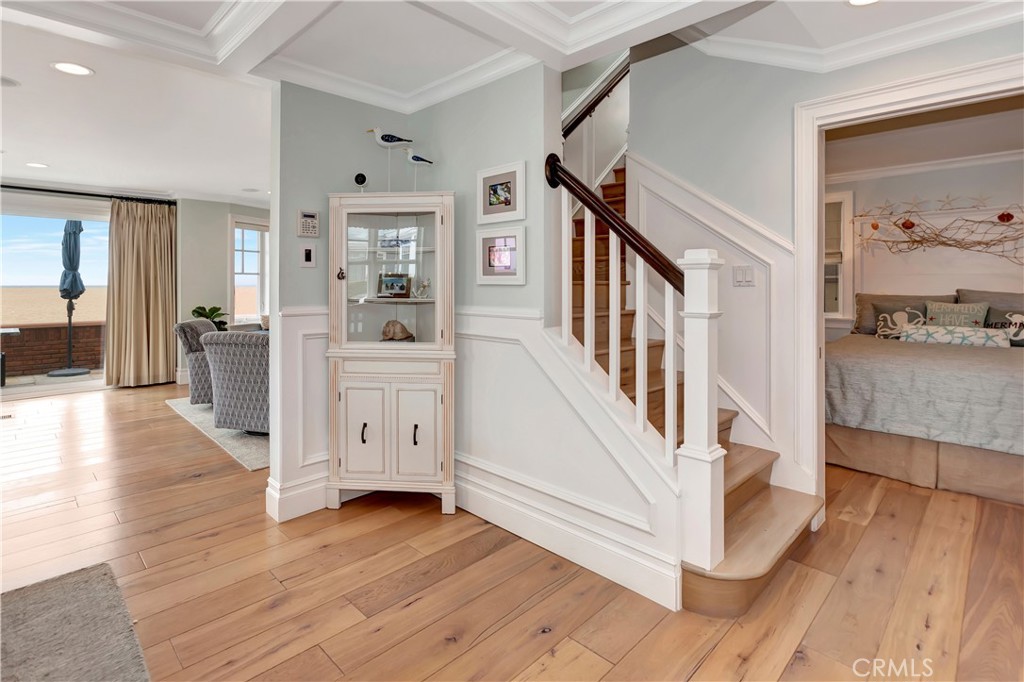 1102 West Oceanfront Newport Beach, CA 92661 - Photo 11 of 32 a view of a hallway with wooden floor and staircase