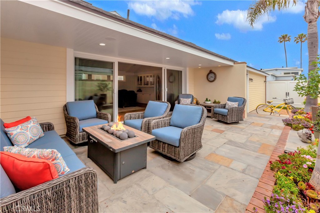 1102 West Oceanfront Newport Beach, CA 92661 - Photo 12 of 32 a outdoor living space with furniture and a potted plant